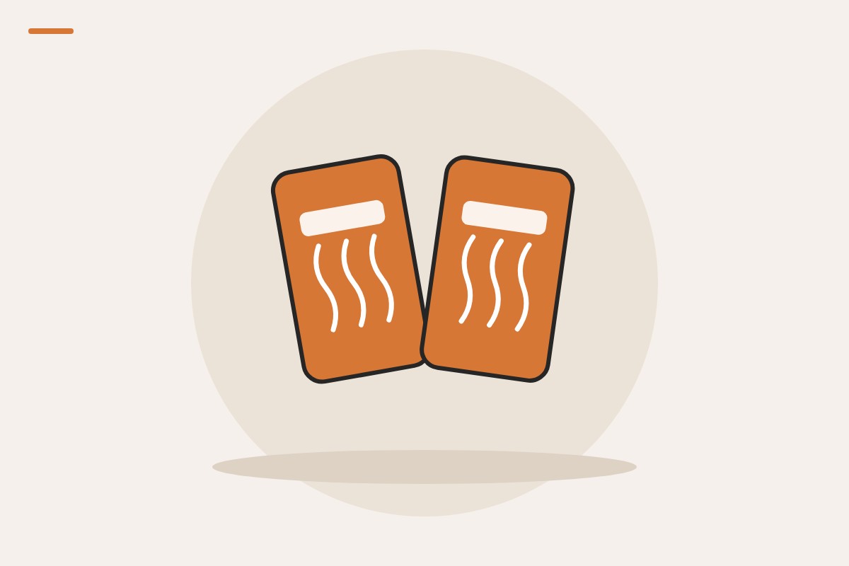 Illustration of two orange air-activated hand warmer packets